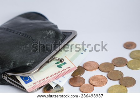 An opened wallet with euro banknotes inside