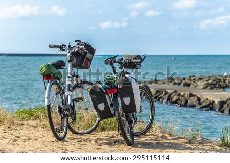 SAINT-JEAN-DE-LUZ, FRANCE: JUNE, 18: A view on two charched bicycles in front of the sea in the Basque Country in Saint-Jean-de-Luz, France on June, 18, 2015
