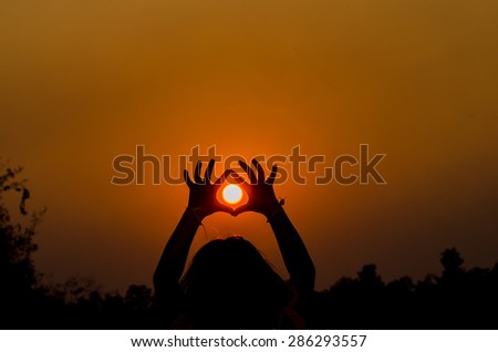 Silhouette hand with Sun