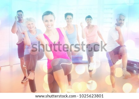 Smiling people doing power fitness exercise at yoga class against abstract background