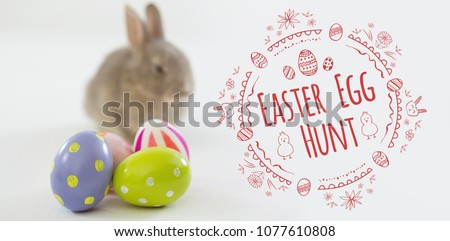 Easter Egg Hunt logo against white background against easter eggs and easter bunny