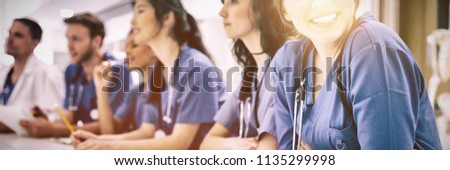 Medical student smiling at camera during class at university