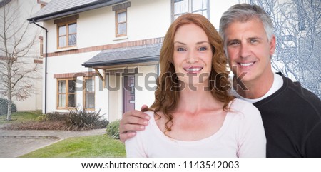 Casual couple smiling at camera against pretty house with a blue and white filter