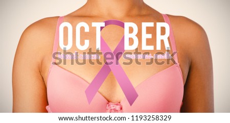 Breast cancer awareness ribbon with text against woman for breast cancer awareness