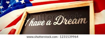 I have a dream against empty slate over american flag  on table
