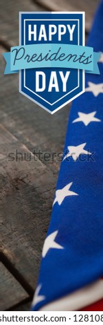 Happy presidents day against folded american flag on wooden table