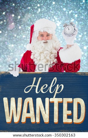 Santa claus holding alarm clock and sign against vintage help wanted sign