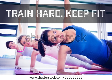 Women in side plank yoga pose against motivational new years message