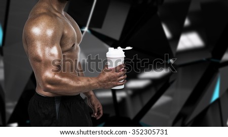 Muscular man with protein powder against black angular design