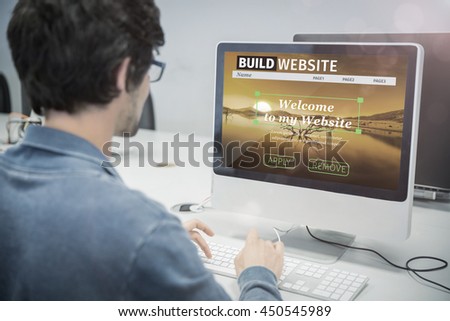 Composite image of build website interface against over the shoulder view of of serious casual man working at computer desk