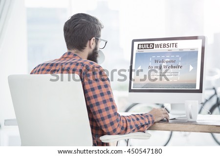 Composite image of build website interface against hipster using a computer