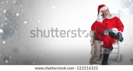 Excited Santa Claus talking on mobile phone against snowflake pattern