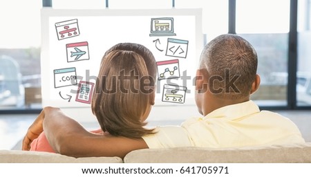 Digital composite of Rear view of couple looking at various icons on desktop pc while sitting at home