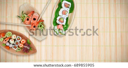 High angle view of fresh salmon sushi against close up of sushi mat