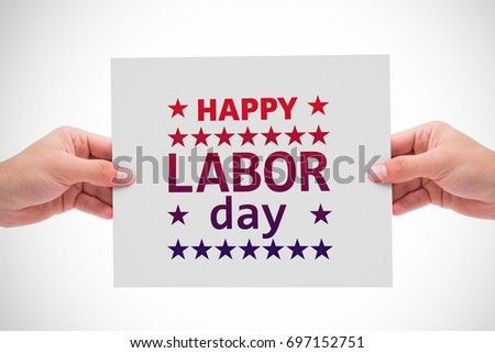 Hand showing card against poster of happy labor day text