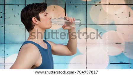 Digital composite of Man in training gear drinking water against tiles and bokeh