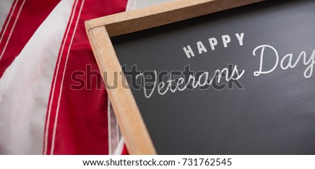 Logo for veterans day in america  against american flag and slate