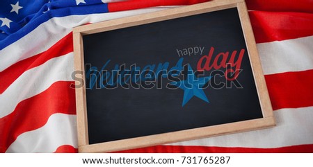 Logo for veterans day in america  against american flag with chalkboard