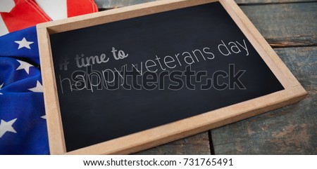 Logo for veterans day in america hashtag against chalkboard with american flag