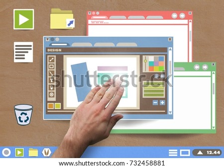 Digital composite of Hand touching Many Website windows and design editor on Paper cut out desktop