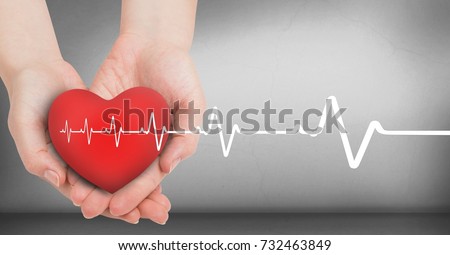 Digital composite of Heart beat over hands holding heart