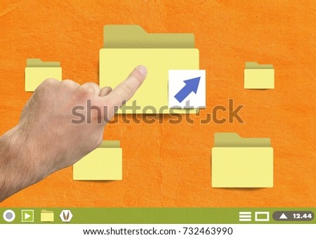 Digital composite of Hand touching Folders on Paper cut out desktop