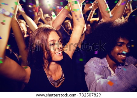 Flying colours against friends dancing at nightclub