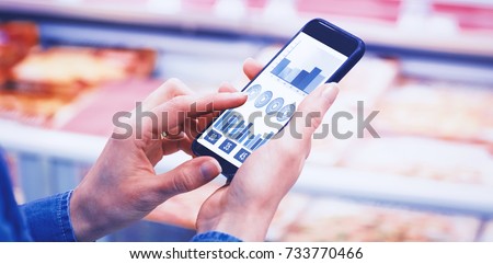 Blue graphics on white background against cropped image of man using mobile phone