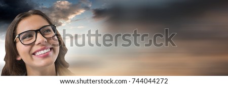 Digital composite of Woman looking up with cloudy background
