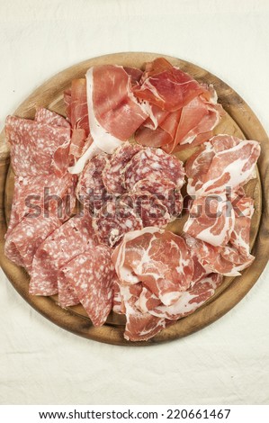 cured meats on a dish vertical
