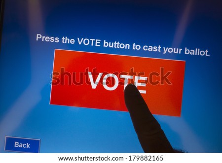 ARLINGTON, VIRGINIA, USA - November 5, 2013, voting on election day using electronic touch screen voting machine.