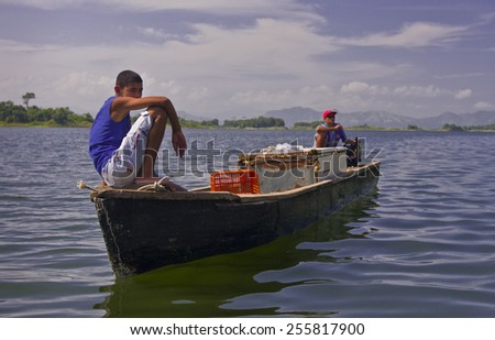 LAKE BAYANO, PANAMA - Kuna men on boat, man-made reservoir Lake Bayano, in Comarca Kuna de Madungandi indigenous territory.