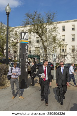 WASHINGTON, DC, USA - APRIL 06, 2015: Capitol South Metro station sign and people.