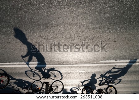 Long shadows cyclists during the bike ride