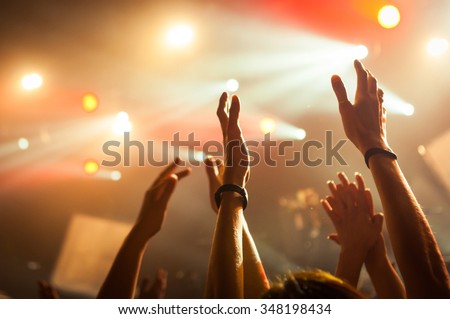 hand fans during a concert