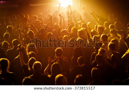 The crowd during a performance dj in a nightclub
