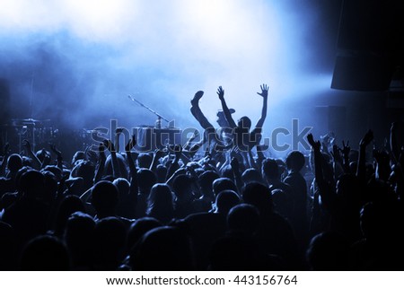 Crowd surfing during a musical performance