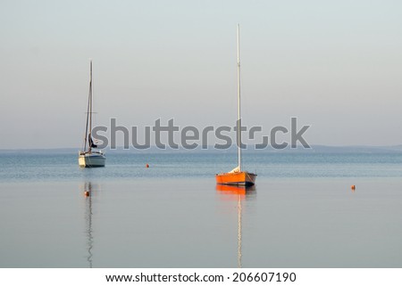 boats in the lake in the morning