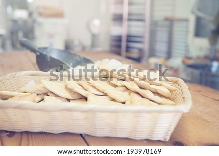 Traditional italian crisp crackers in a basket, in vintage light colors.