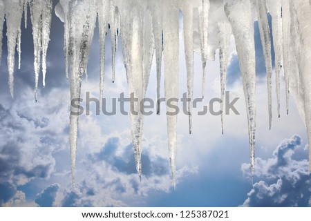 number of natural icicles on sky background with saved photoshop clipping Path