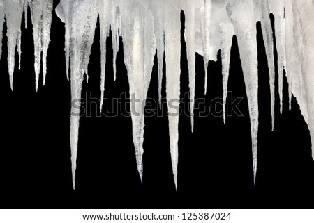 number of natural icicles on a black background with saved photoshop clipping Path