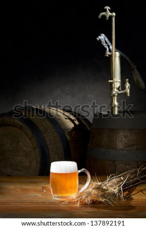 beer still life on the table with old  beer kegs tap