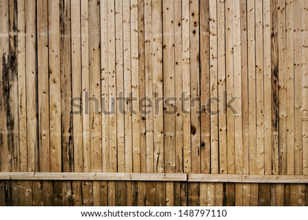 narrow vertical wooden planks with horizontal line as background