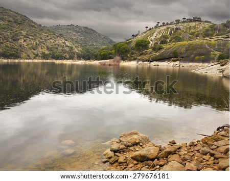 San Juan reservoir and Yelmo cliff  in San Martin de Valdeiglesias. Madrid. Spain. Europe.
