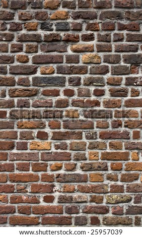 Picture of a very old brick wall with lime mortar