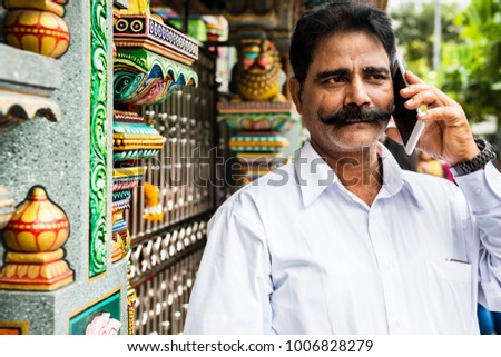 Indian people using mobile phone