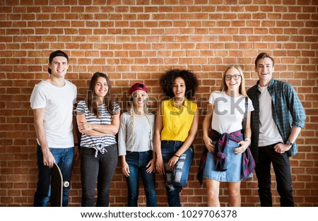 Happy young adult group of friends youth culture concept