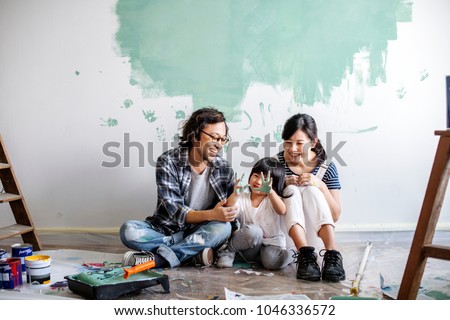 Asian family renovating the house