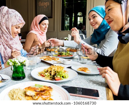 Islamic friends dining together