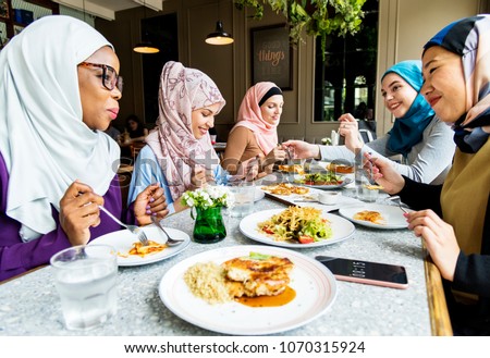 Islamic friends dining together